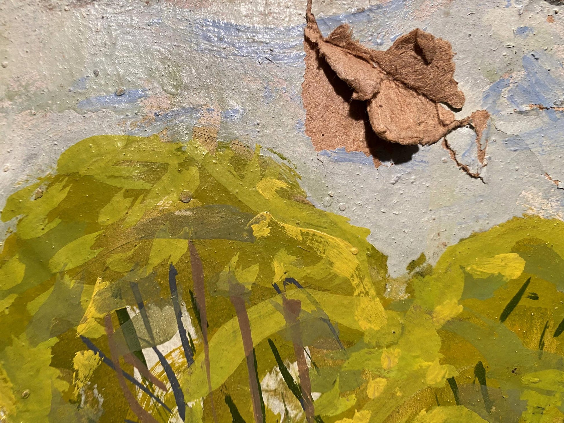 Dried brown leaf on Georgy Kolosovsky oil painting above river with yellow green wall
