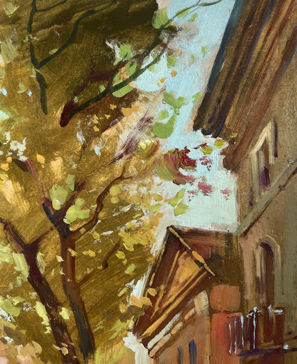 Warm-toned oil painting of city alley with river and autumn trees by Yuriy Suprunchuk
