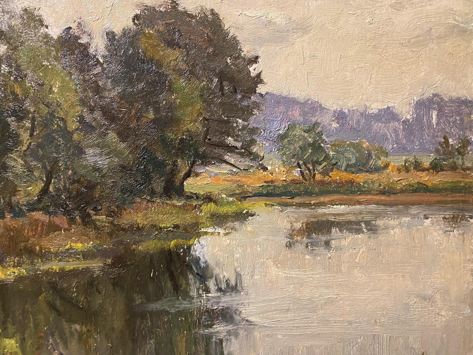 Oil painting by autumn Nikolay Rabotyagov: serene river with trees and hills