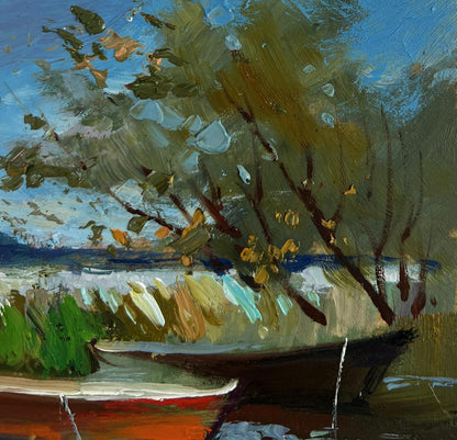 Oil painting of boats moored on shore by Yuriy Suprunchuk