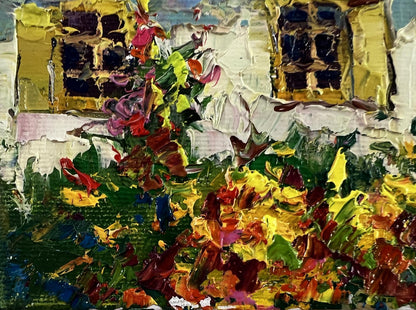 Vibrant oil painting of yellow house in flower garden by Oksana Ivanyuk
