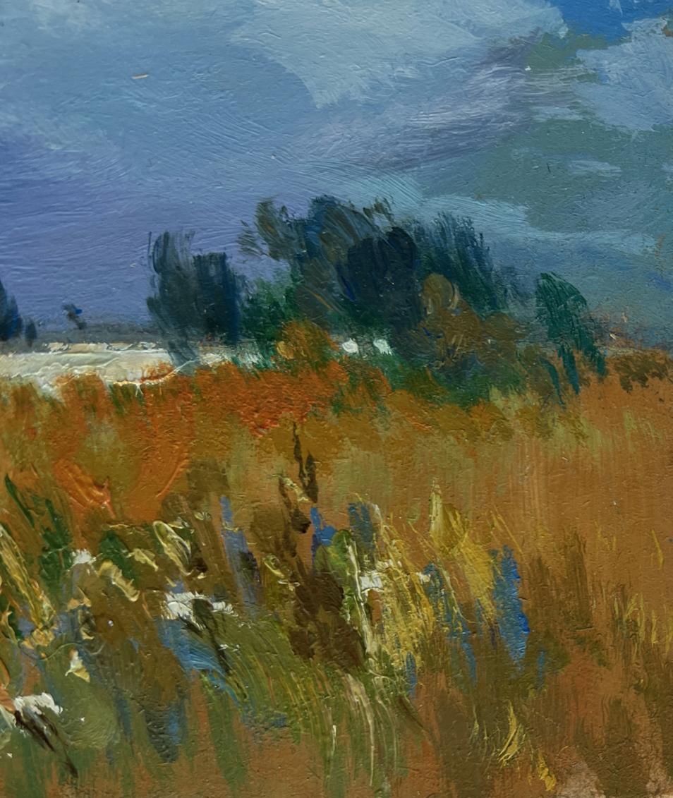 Vibrant impressionist oil painting by Yuriy Suprunchuk of golden field with sun through clouds