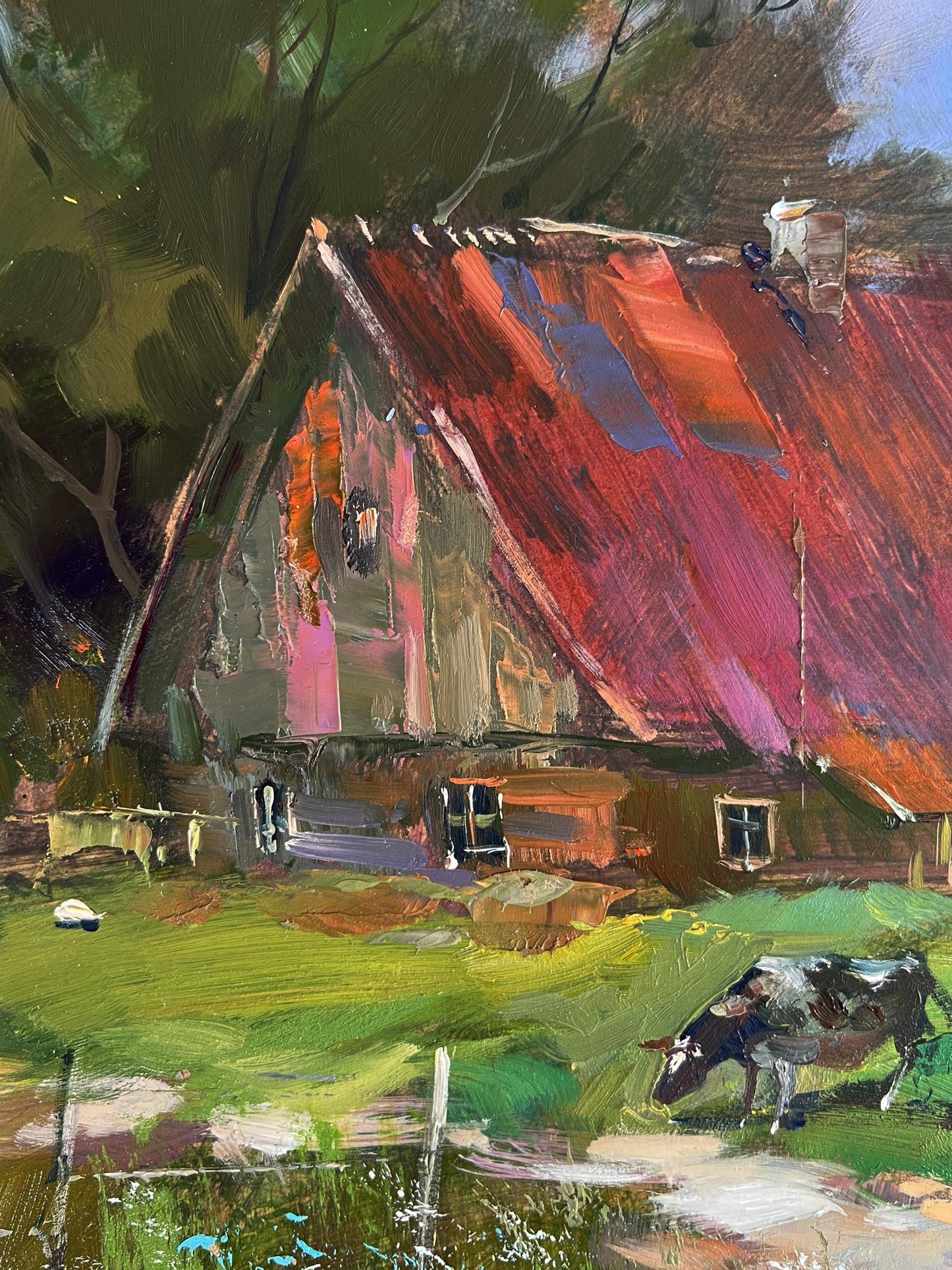 Oil painting by Yuriy Suprunchuk: rustic farmhouse with red-purple roof, grazing cow