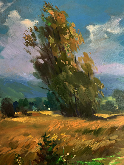 Oil painting by Yuriy Suprunchuk: tall tree in sunlit flower field