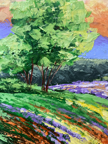 Vibrant impressionist oil painting by V. Zadorozhnya: lush tree in flower field under yellow clouds