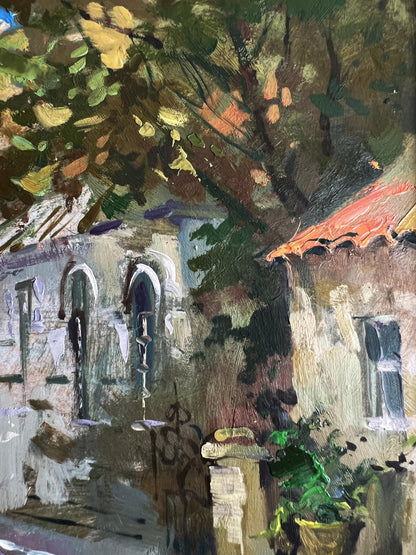 Oil painting of rustic stone building on bustling old street by Yuriy Suprunchuk