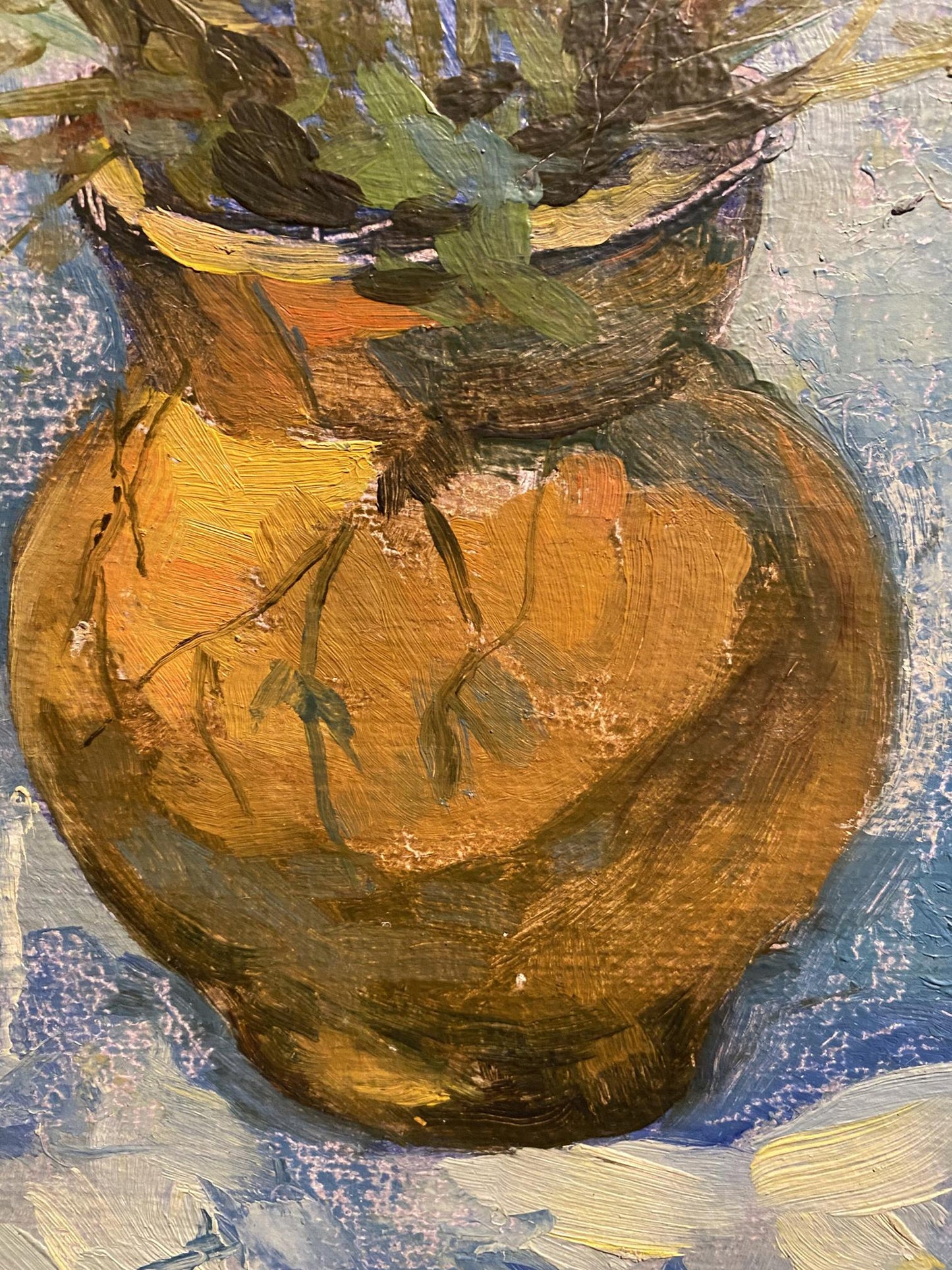 Textured orange ceramic vase with green foliage by Vladimir Podlevskii