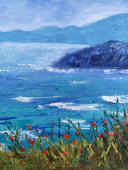 A vibrant impressionist painting of a coastal scene with turquoise waves, distant blue mountains, and red flowers in the foreground.