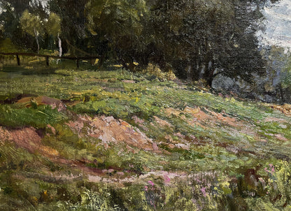 Oil painting of sunlit grassy field with wildflowers by Nikolay Rabotyagov
