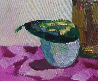 Glossy green blue ceramic bowl on pink surface by Tatyana Shulyak