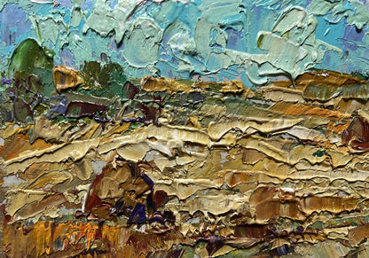 Oil painting White clouds over the field by Oleksiy Ivanyuk in teal and gold tones