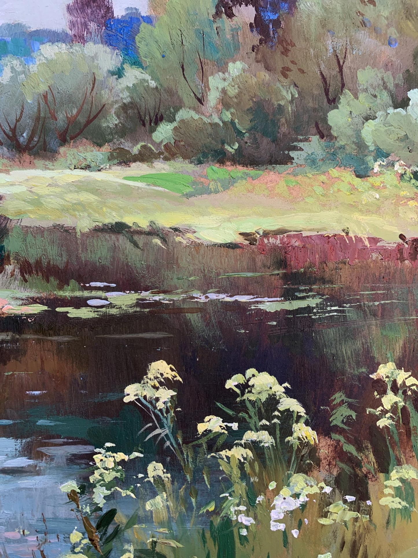 Vibrant oil painting of river along forest by Yuriy Suprunchuk