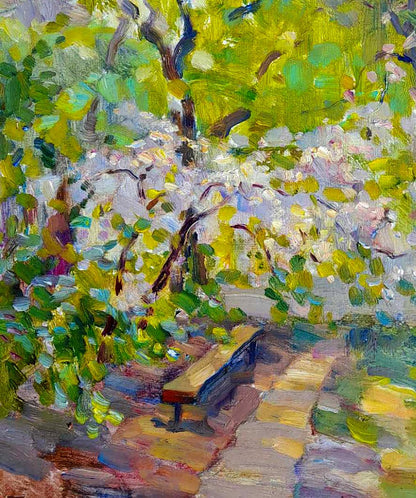 Painting of wooden bench with dark blue seat under blooming white trees by Ivan Kovalenko