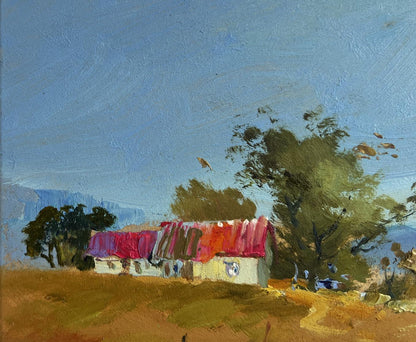 Oil painting of rustic white house with vibrant red purple roof by Yuriy Suprunchuk