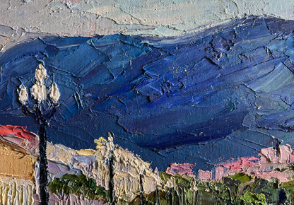 Oil painting of city embankment with dark blue mountains by Boris Serdyuk