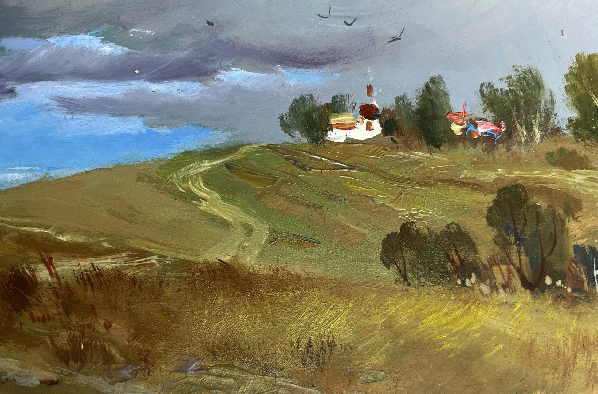 Rustic oil painting by Yuriy Suprunchuk: white church with red accents amid trees under grey cloudy sky