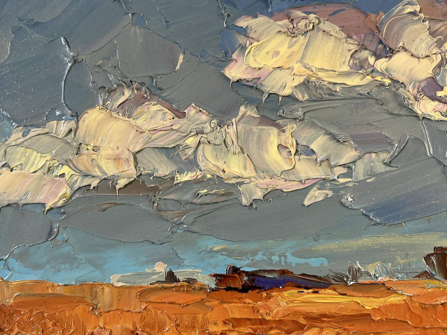 Impasto oil painting by Boris Serdyuk: gray-blue sky, pink clouds over orange terrain