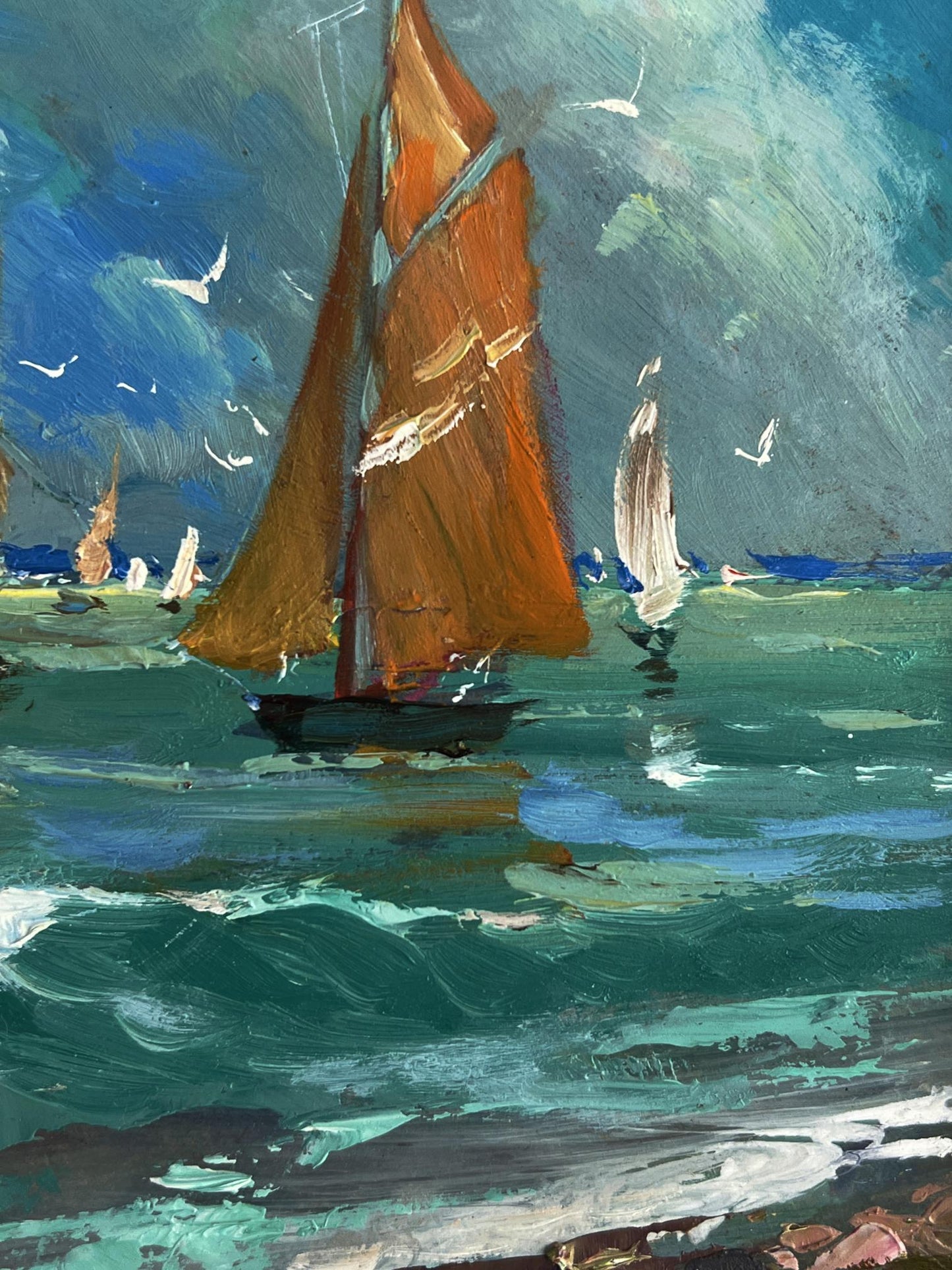 Oil painting of vibrant orange sailboat by Yuriy Suprunchuk at sea