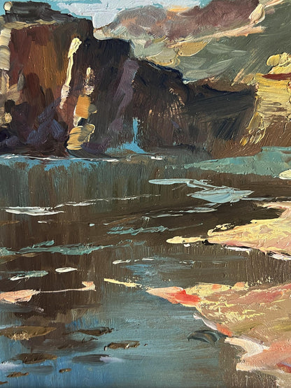 Impressionistic oil painting of rugged coast near mountains by Yuriy Suprunchuk