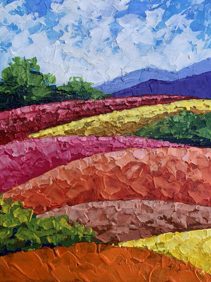 Vibrant oil painting by V. Zadorozhnya: mountains, plains in pink, yellow, green under blue sky
