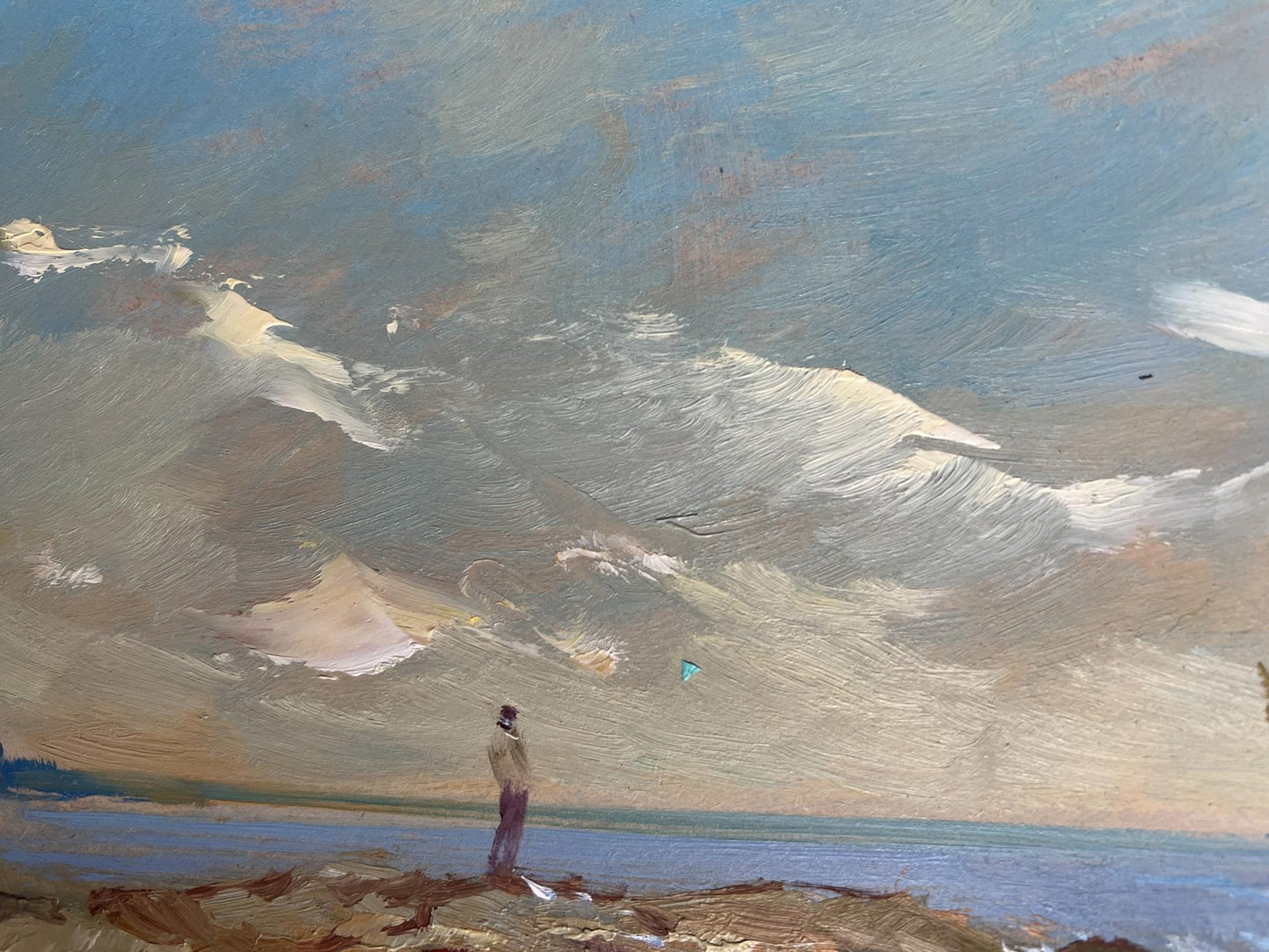 Oil painting by Yuriy Suprunchuk: solitary figure on rocky shoreline at sunset sea