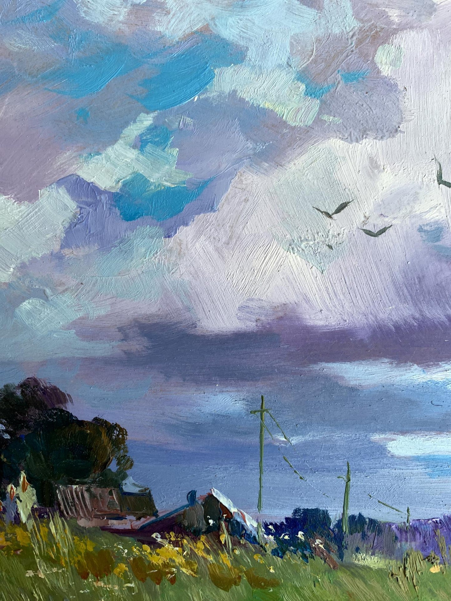 Impressionistic oil painting by Yuriy Suprunchuk of swirling blue-purple clouds over village field