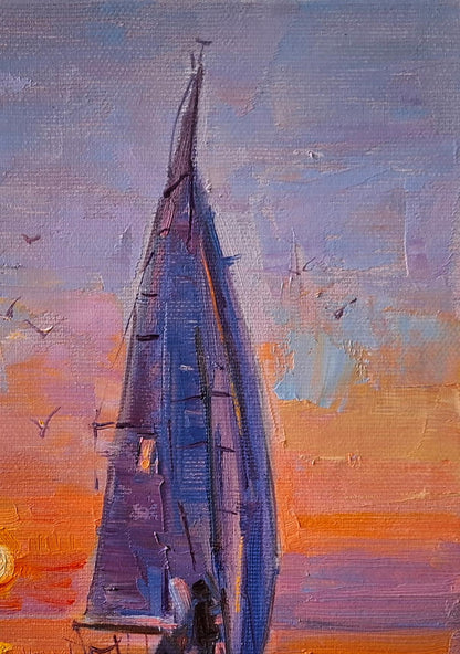 Oil painting Evening at sea by Vyacheslav Pereta: tall blue sailboat at vibrant sunset