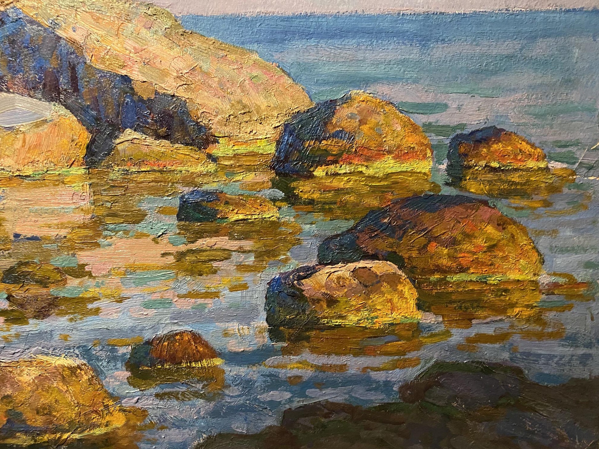 Oil painting of sunlit seashore rocks by Grigoriy Ruban