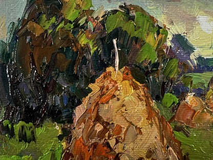 Oil painting of haystacks in field by Oksana Ivanyuk with rocky outcrop
