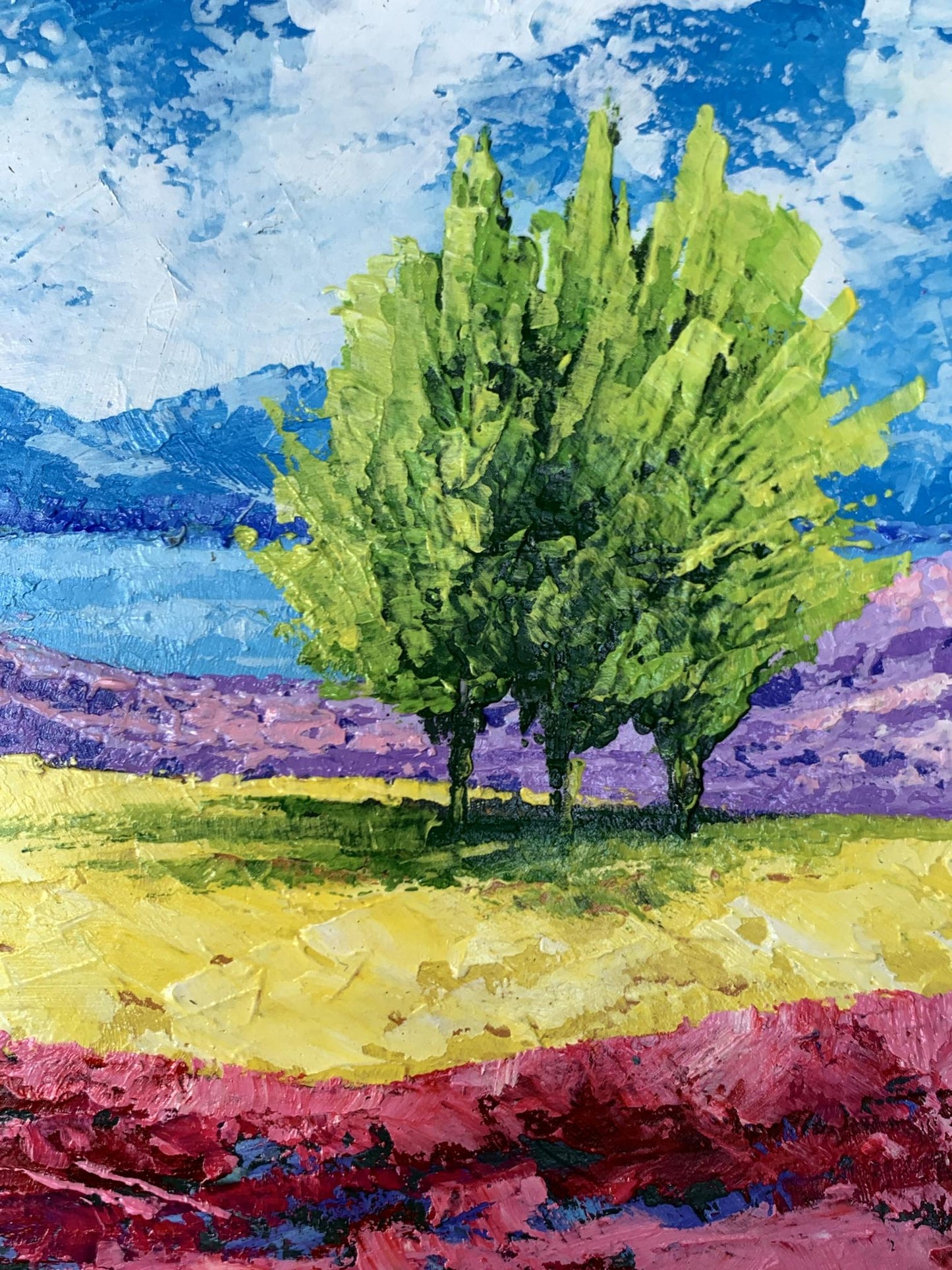 Oil painting of mountain lake and three vibrant green trees by V. Zadorozhnya