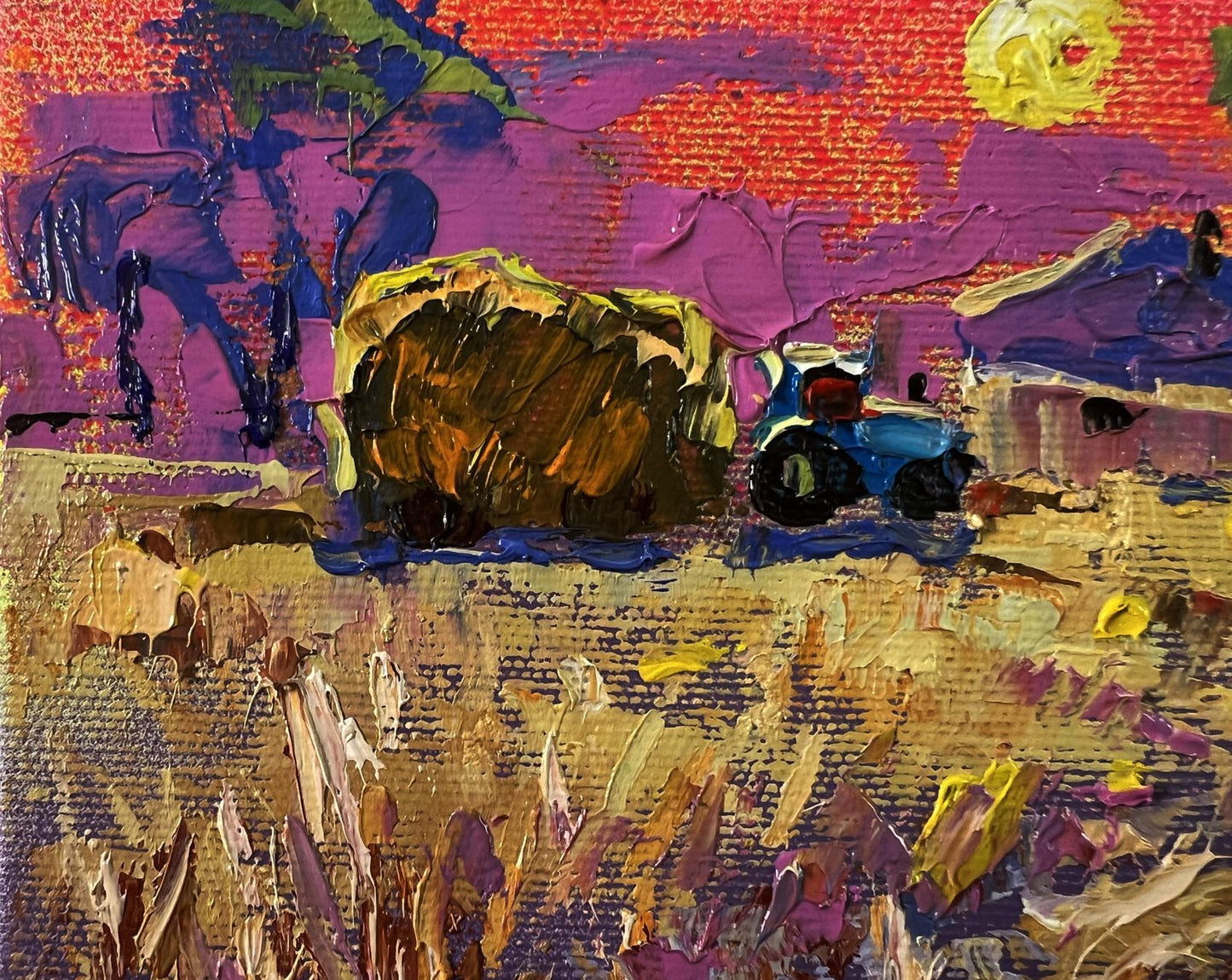 Oil painting Evening village by Oleksiy Ivanyuk: blue tractor pulling hay bale in golden field at sunset