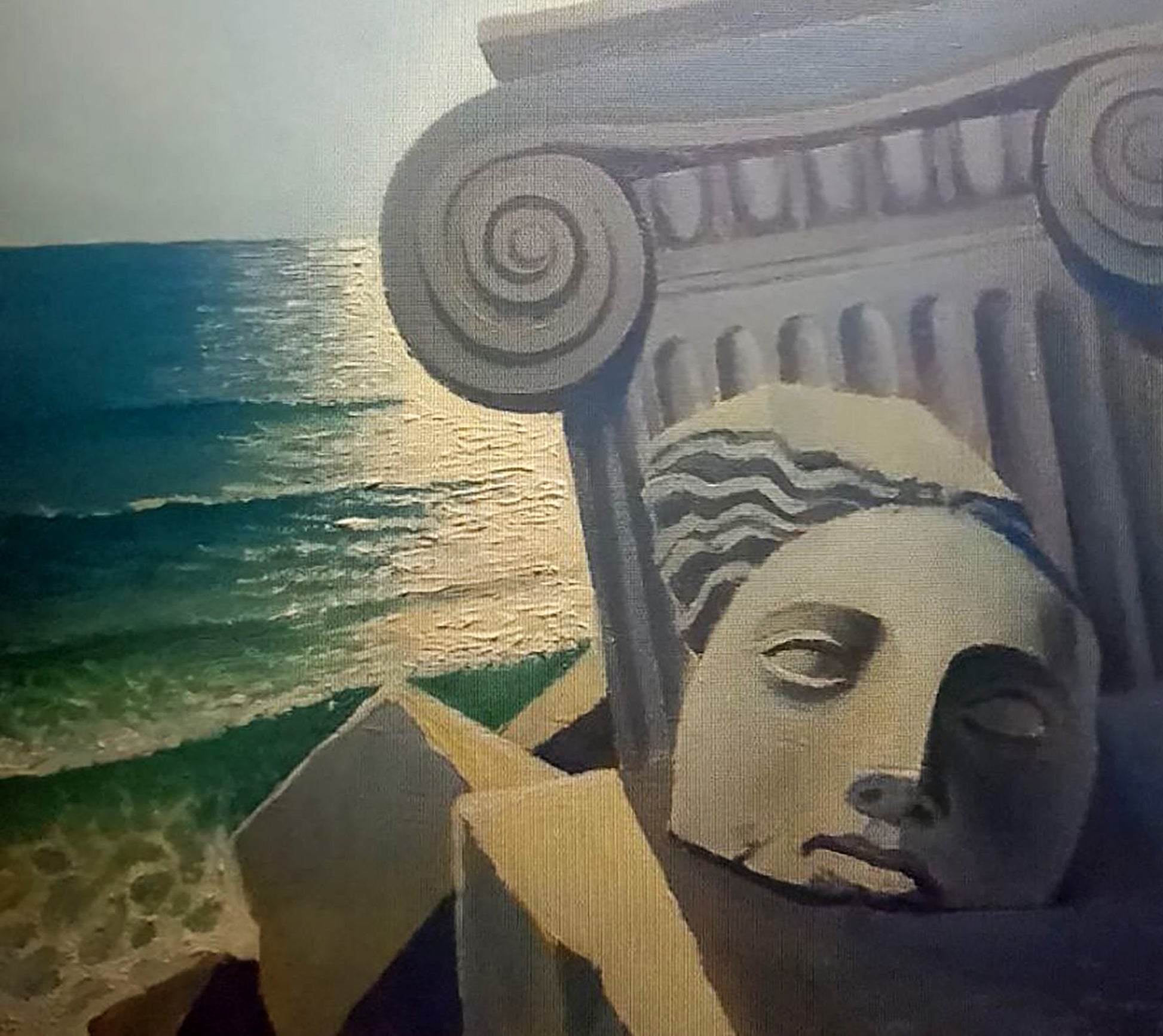 Serene painted stone face by Alexander Strashevich on column by turquoise waves
