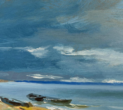 Oil painting The call of distant waves by Yuriy Suprunchuk: rowboats on shore under swirling sky