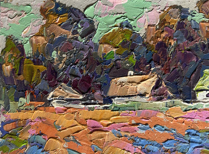 Vibrant oil painting of colourful fields and village by Oksana Ivanyuk