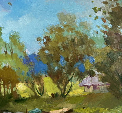 Oil painting of quiet ferryman in pastel cottage village by Yuriy Suprunchuk
