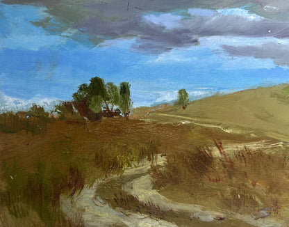 Textured oil painting by Yuriy Suprunchuk of rolling landscape under grey cloudy blue sky