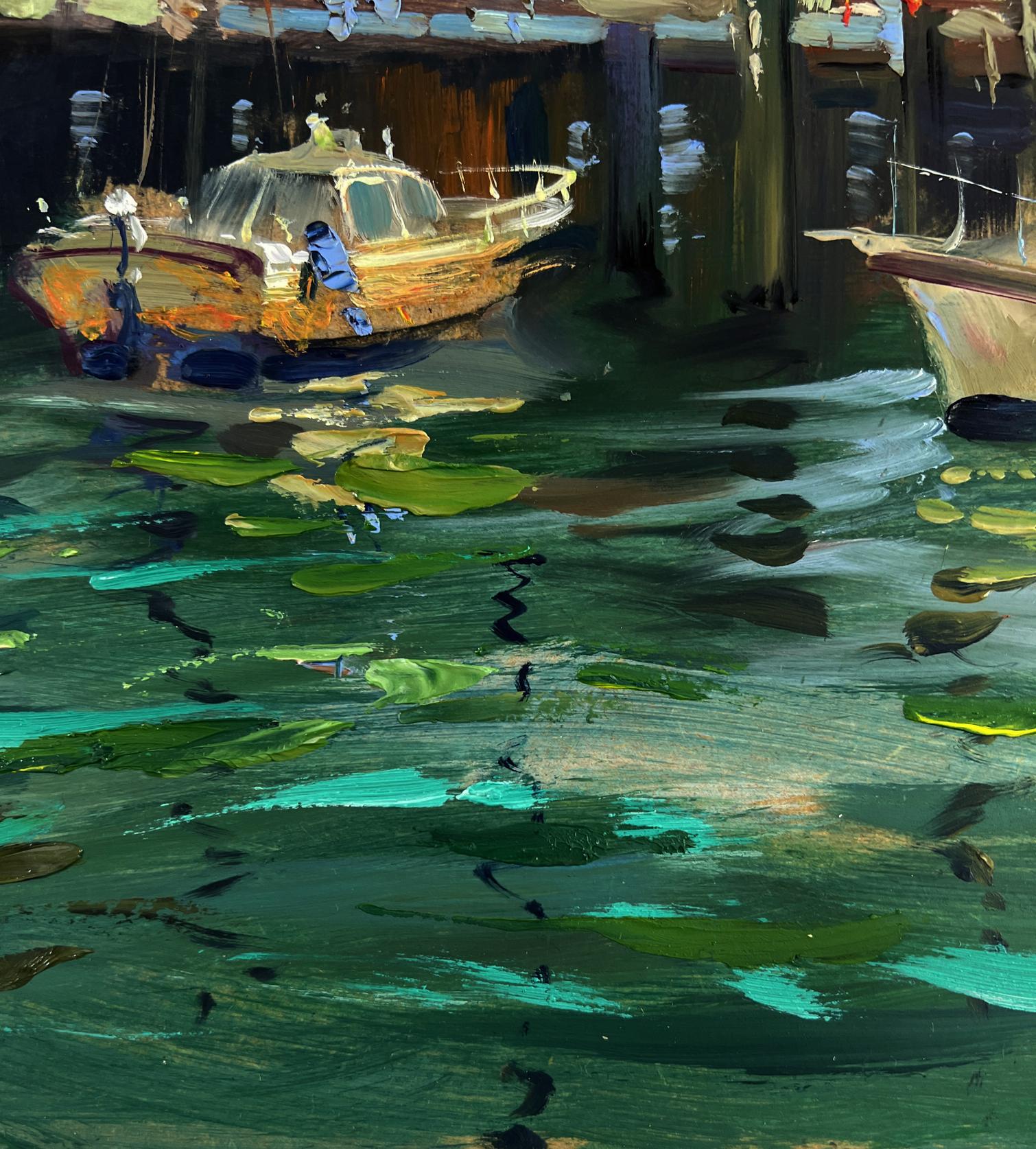 Weathered wooden yacht in greenish lily pad water by Yuriy Suprunchuk