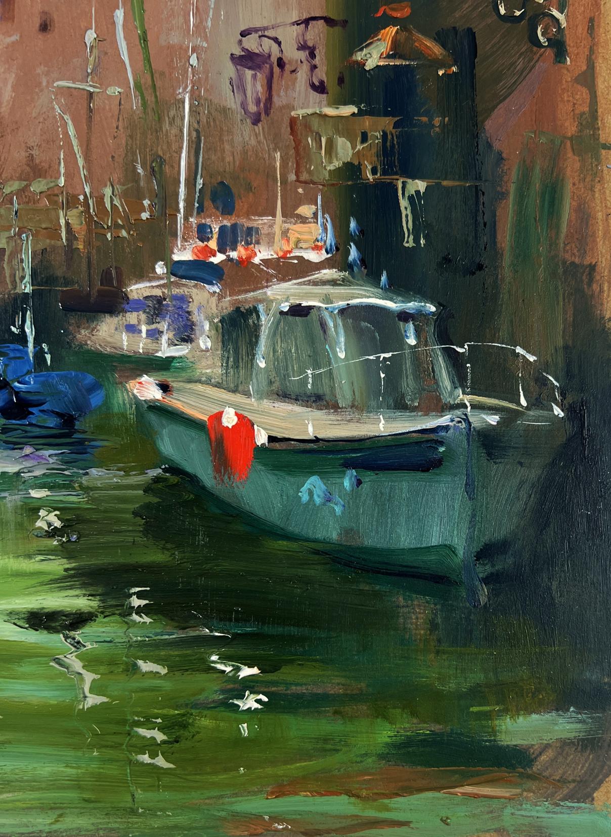 Teal-green boat with red patch docked in calm water by Yuriy Suprunchuk