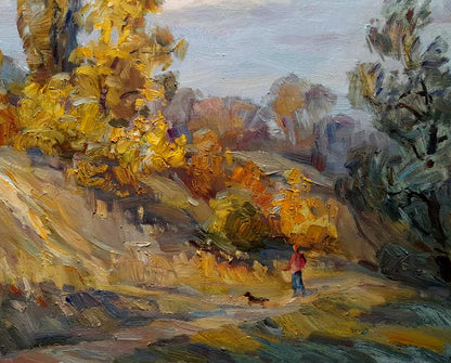 Person in red jacket walks small dog in autumn park by Ivan Kovalenko