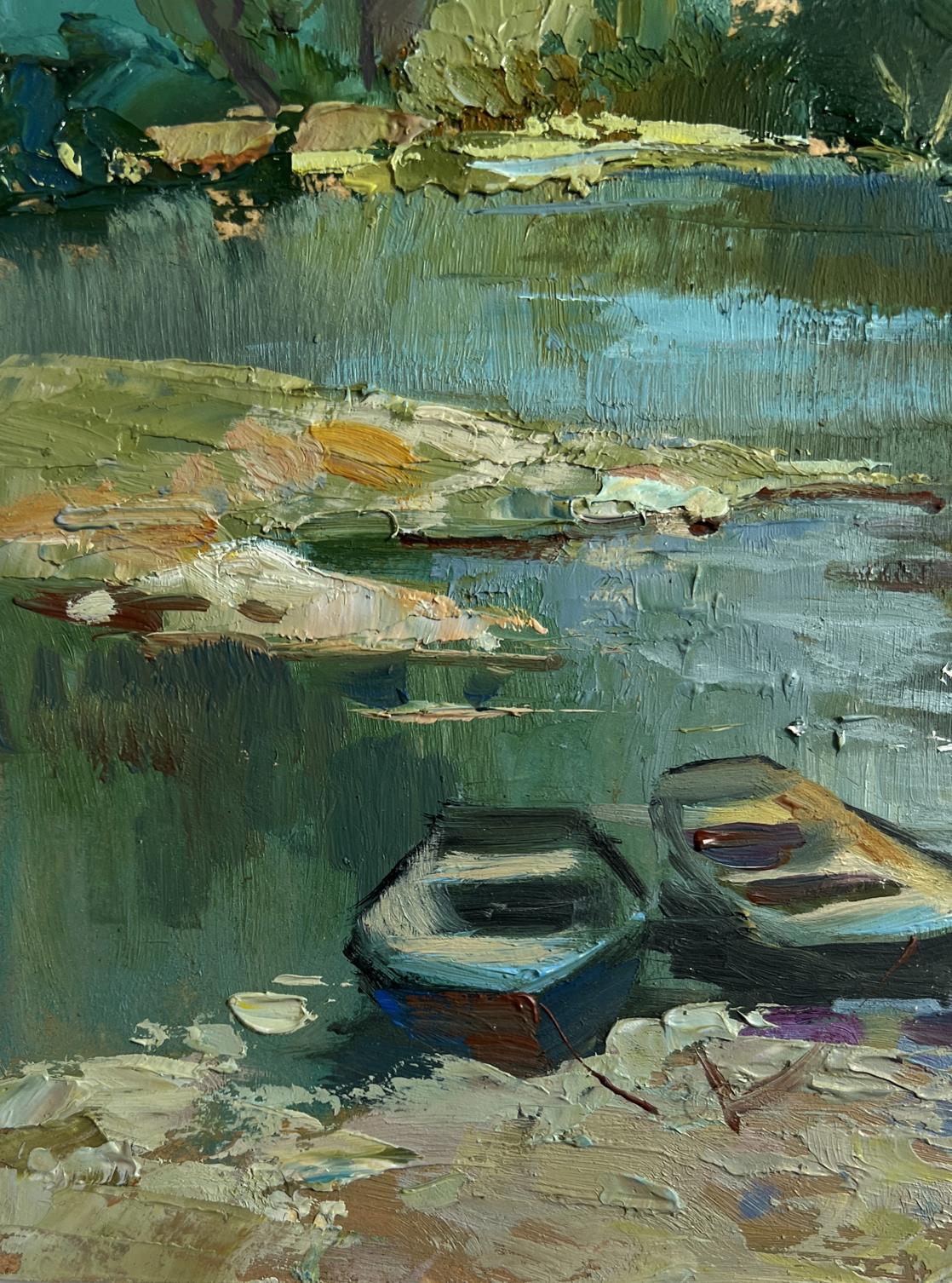 Oil painting of river in forest thicket with boats on pebbled shore by Yuriy Suprunchuk