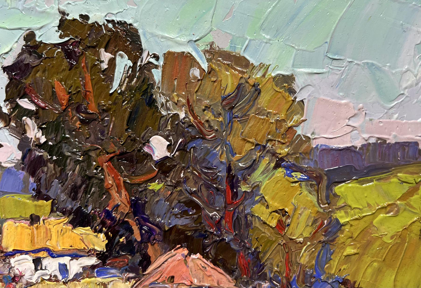 Impasto oil painting of village houses by Oksana Ivanyuk in earthy tones