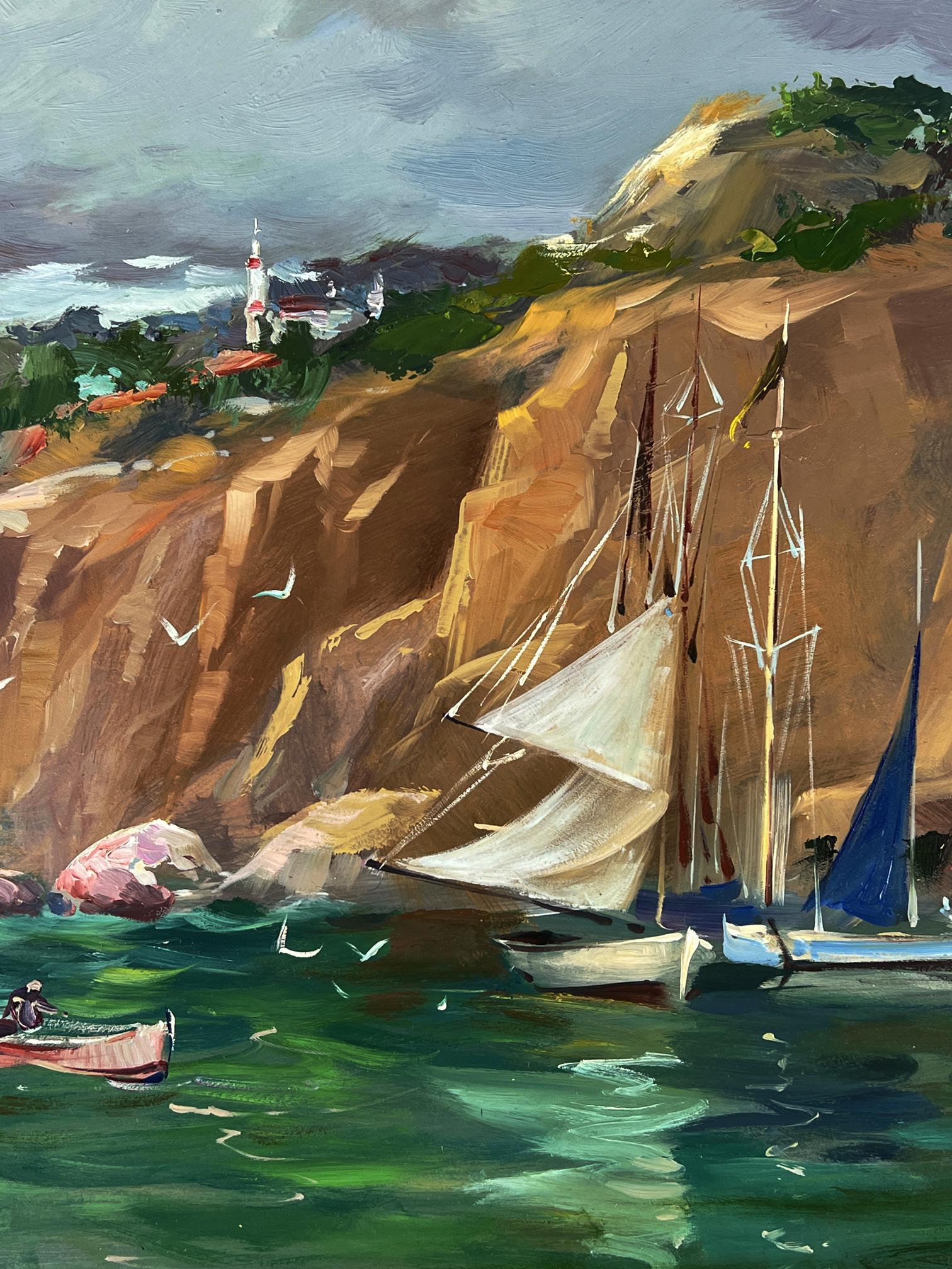 Oil painting Ships at the Mountain by Yuriy Suprunchuk with sailboats, cliffs, lighthouse