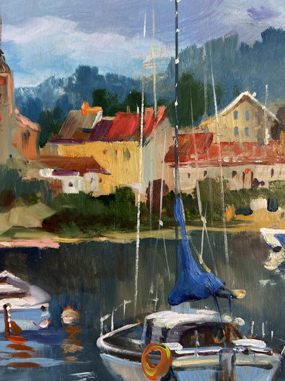 Oil painting of blue sailboat with white hull off colorful city coast by Yuriy Suprunchuk