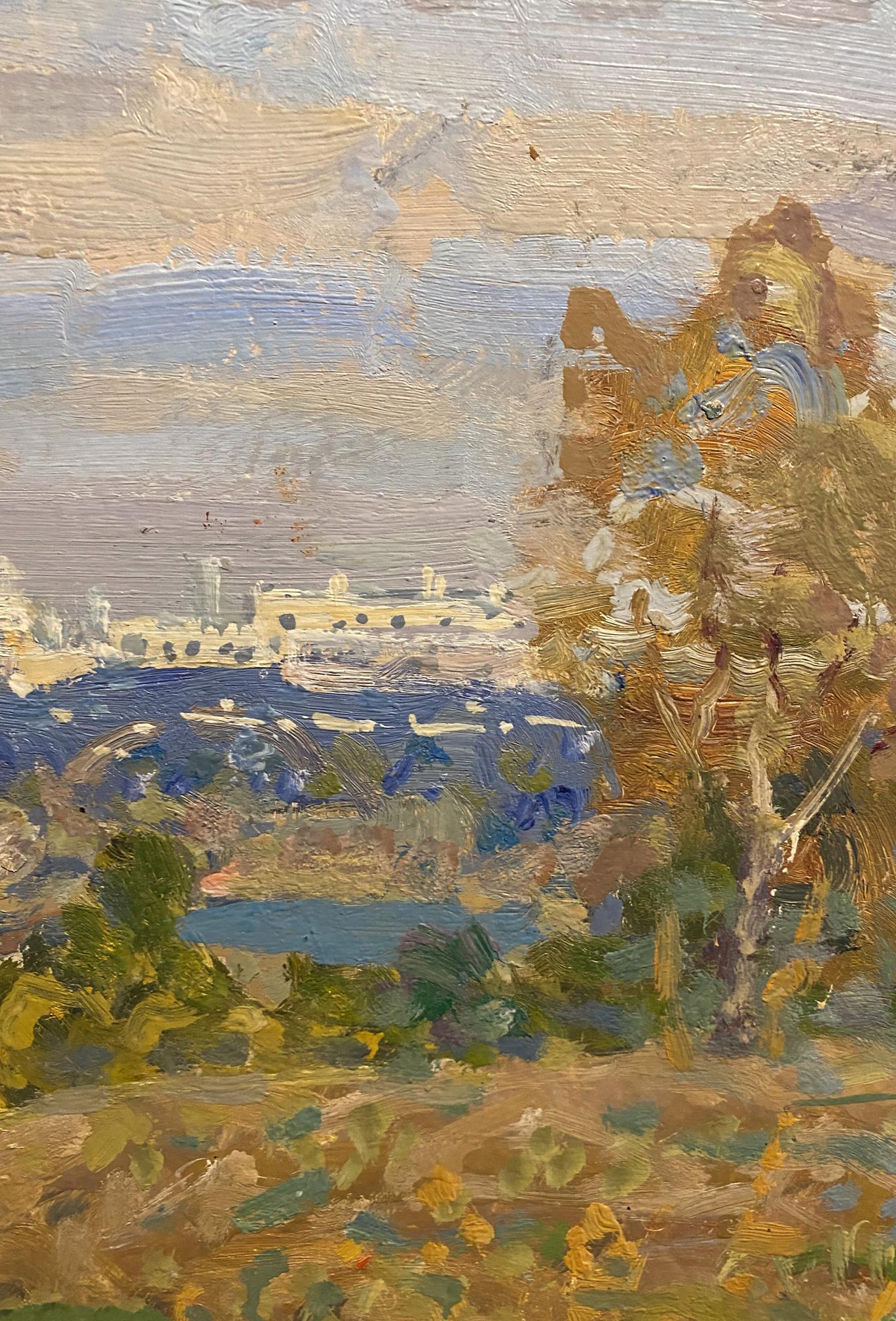 Oil painting of coastal landscape with city in distance by Georgy Kolosovsky
