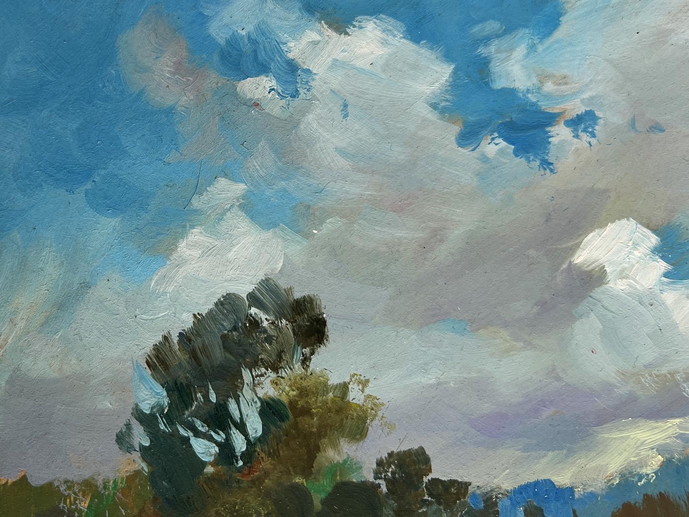 Oil painting of swirling blue clouds over dark tree silhouettes in summer meadow glade by Yuriy Suprunchuk