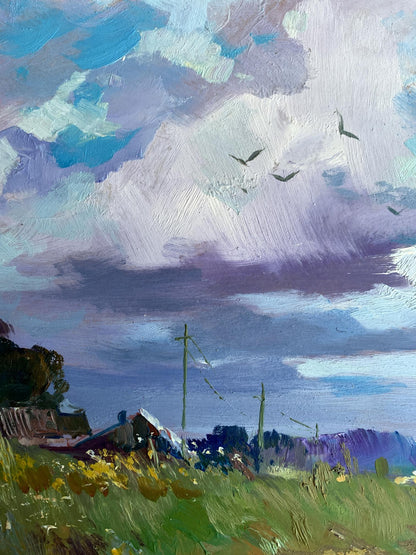 Oil painting In the village field by Yuriy Suprunchuk with dramatic sky