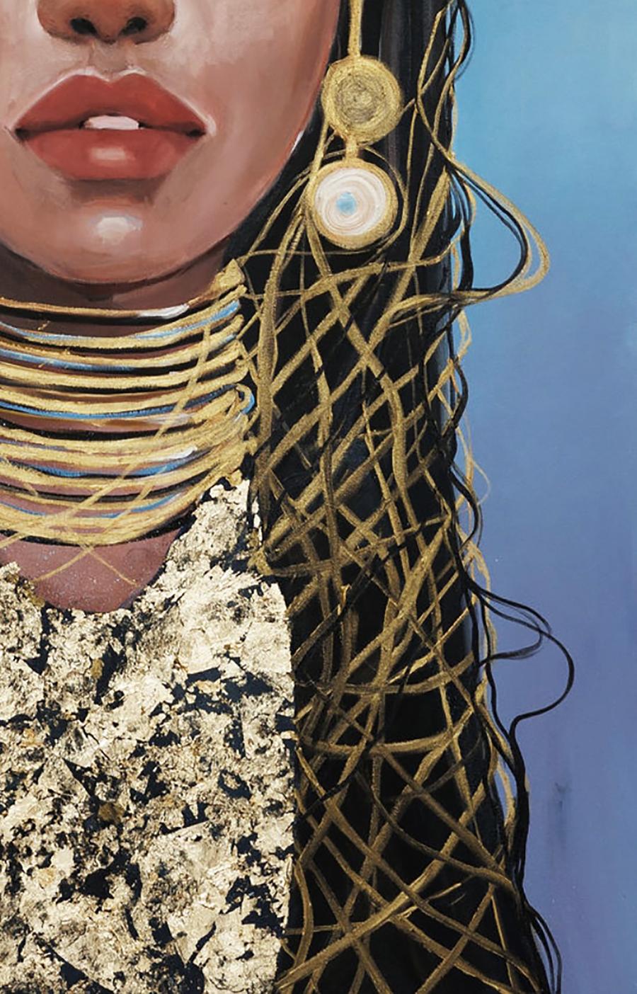 Gold-toned mesh earring with blue-centered ring pendant by Radiance Victoria Kagalovska
