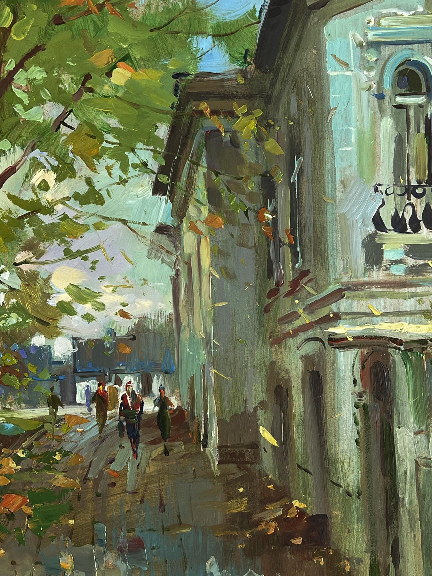Oil painting by Yuriy Suprunchuk: daytime city street with falling green yellow leaves
