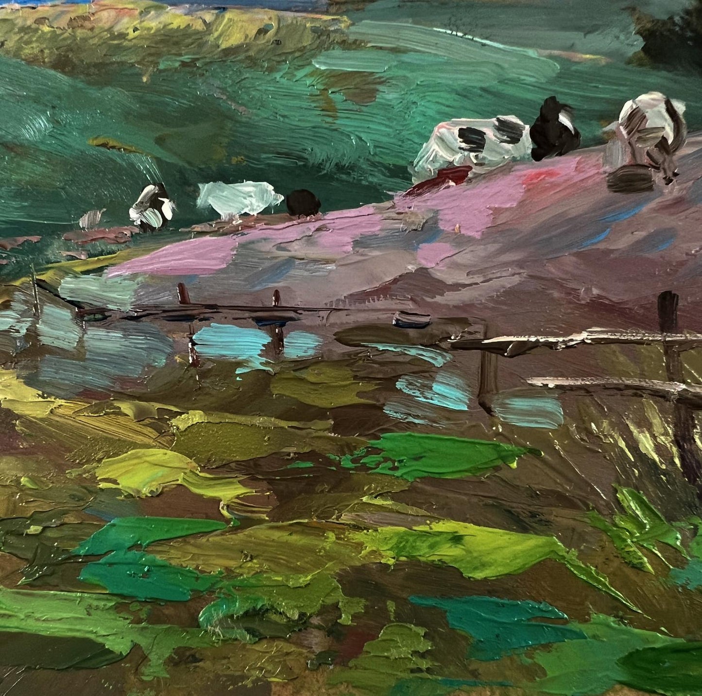 Vibrant impressionist oil painting by Yuriy Suprunchuk of quiet village cows on pink hills