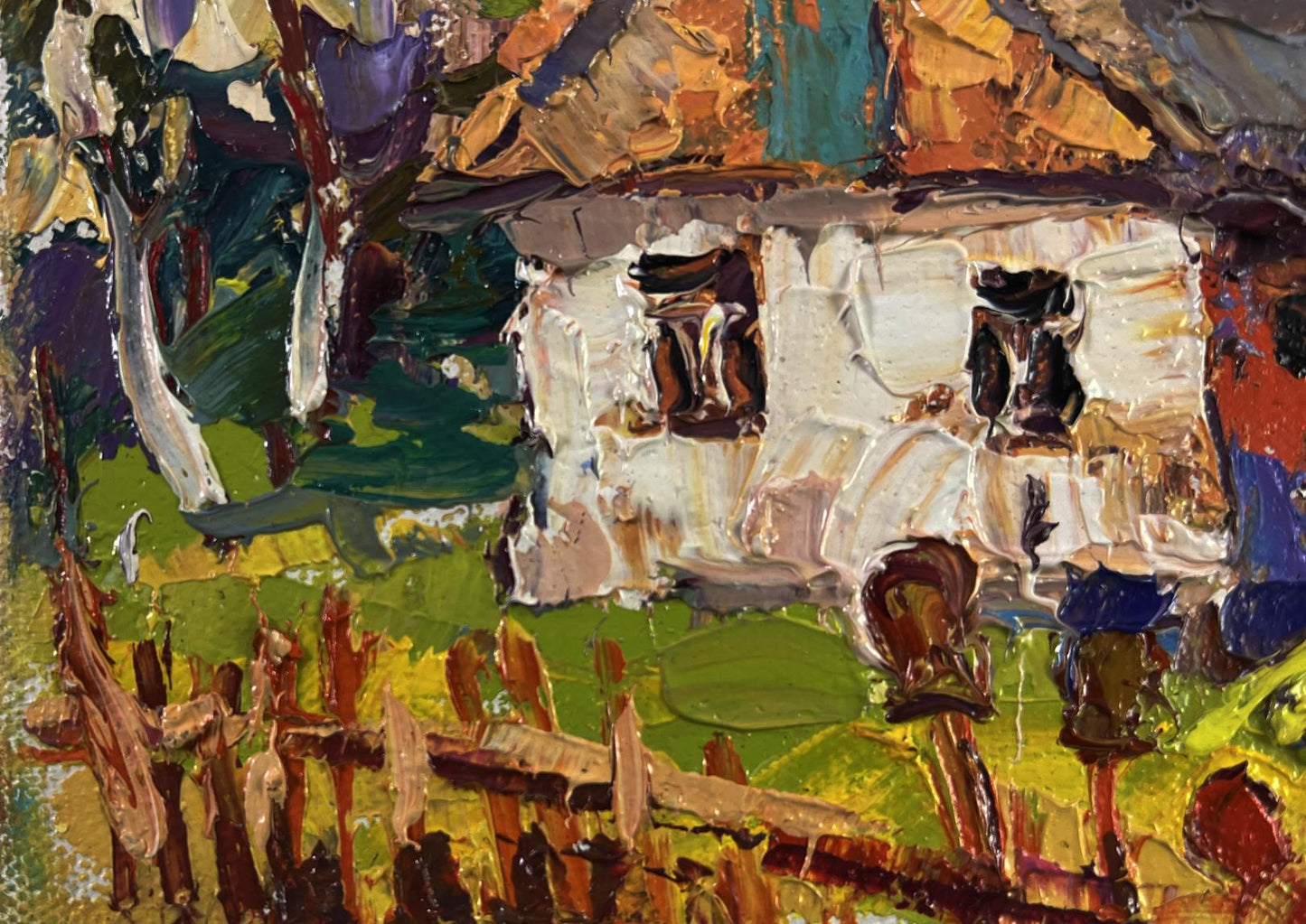 Oil painting of white textured village house with colorful roof by Oksana Ivanyuk